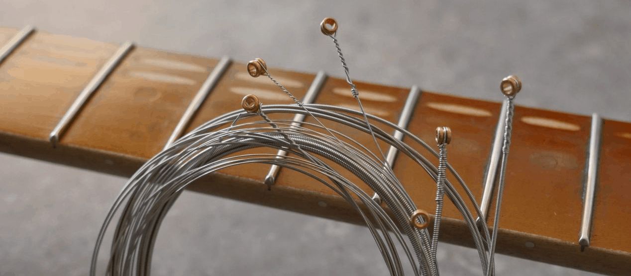 Try a custom set of guitar strings