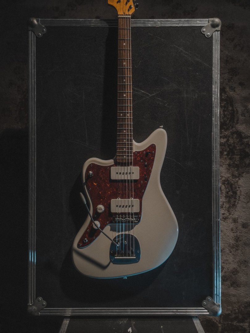 Photo from above of a left-handed Jazzmaster on a road case.