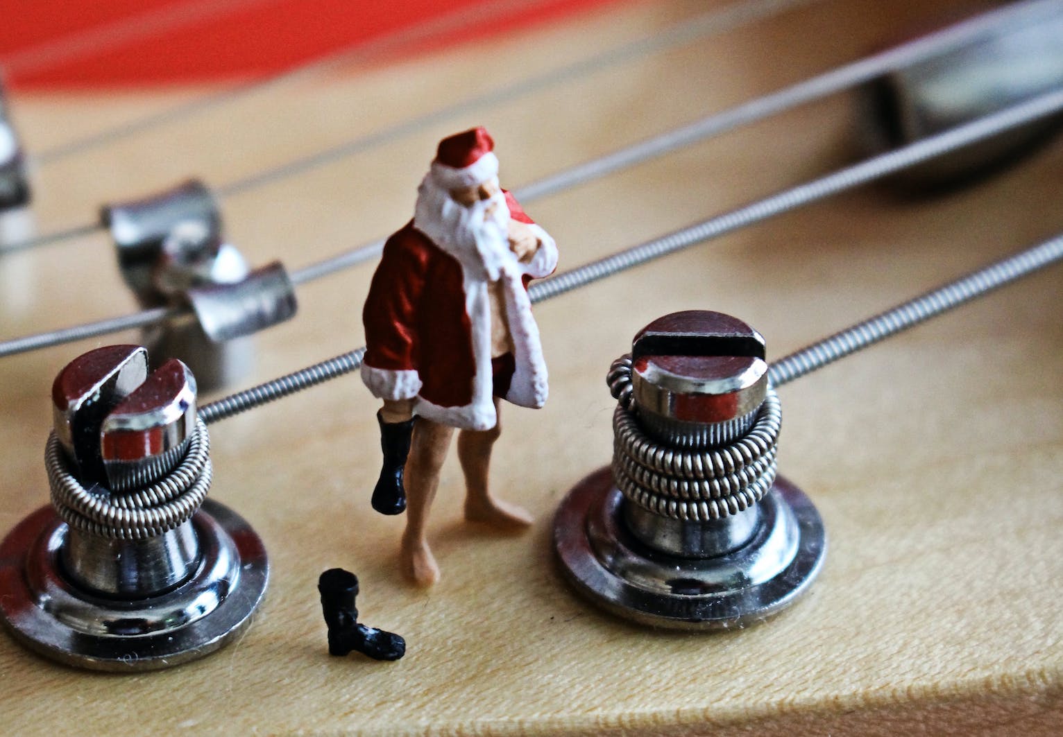 Santa standing on a Stratocaster Guitar